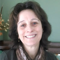 A square portrait of Dina Traniello, the New England TASH Co-President.