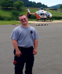 David standing in front of a helicopter