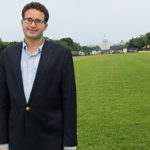 Jake Goodman poses in front of U.S. Capitol Building
