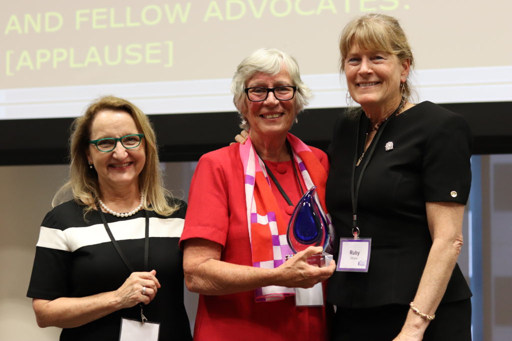 Ruthie-Marie Beckwith and Ruby Moore present Sue Jamieson with TASH's 2018 Outstanding Leadership in Disability Law Award