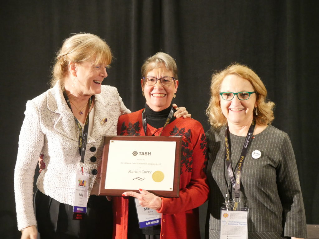 A photograph of Ruby Moore and Ruthy Beckwith presenting an award to Marion Curry