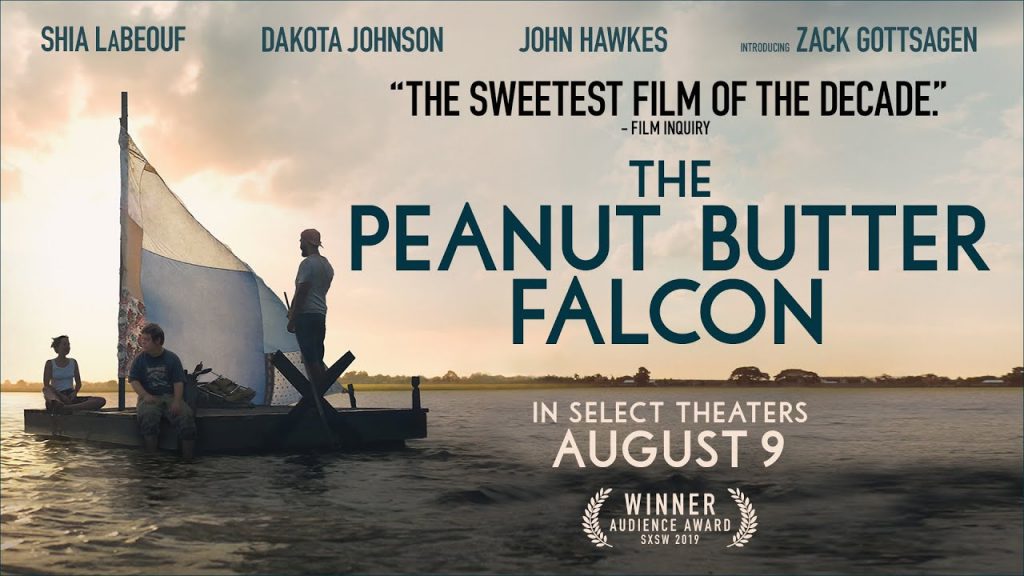 The Peanut Butter Falcon poster: an image of three people on a makeshift raft with a sheet for a sail, drifting on flat water.